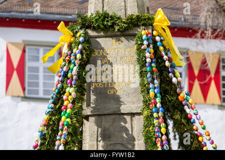 Easter tradition, decoration of the Maximilian fountain, in the old town of Arnsberg, Germany, with hand painted easter eggs Stock Photo