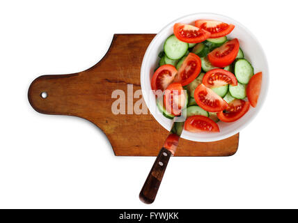 Cucumbers and tomatoes on a cutting board Stock Photo