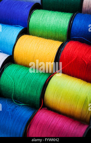 colorful threads on spools Stock Photo