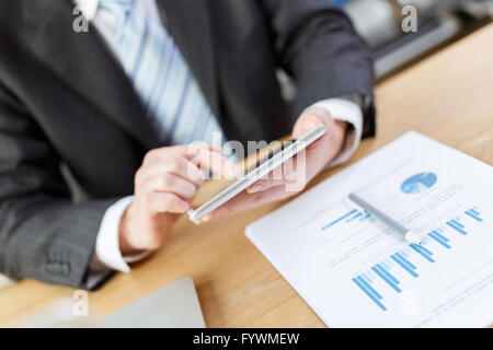 businessman checking financial reports on table Stock Photo