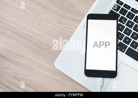 Mobile application development with computer and smartphone Stock Photo