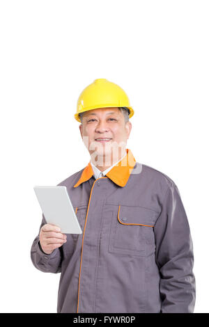 isolated engineer in hardhat with blueprint and tablet Stock Photo