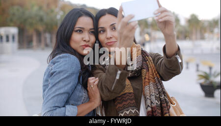 Two gorgeous women posing for a selfie Stock Photo