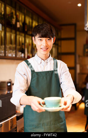 waitress and waiter are serving Stock Photo