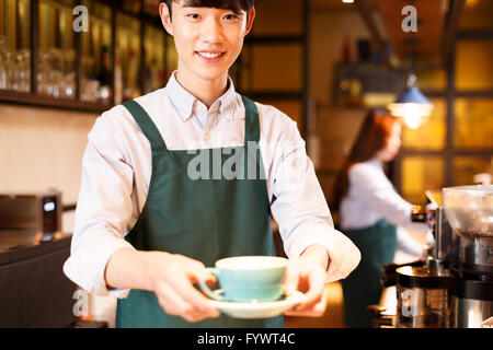 waitress and waiter are serving Stock Photo