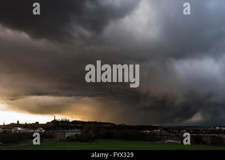 Edinburgh, Scotland, UK. 27th Apr, 2016. Snow and Hail bearing cloud over Edinburgh city centre looking over Holyrood Palace, Scottish Parliament and Calton Hill Credit:  TOM DUFFIN/Alamy Live News Stock Photo