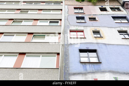 Hundertwasser House vs ordinary house Stock Photo