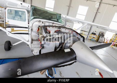 Repairing small propeller airplane Stock Photo