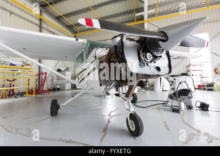 Repairing small propeller airplane Stock Photo