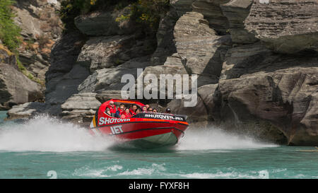 Group of tourists Jet boating on Shotover River at Arthurs Point, Queenstown, Otago, New Zealand's South Island.