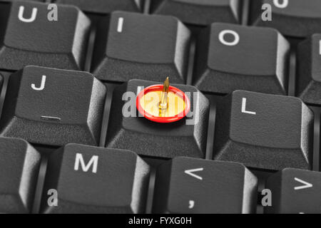 Pin on computer keyboard Stock Photo