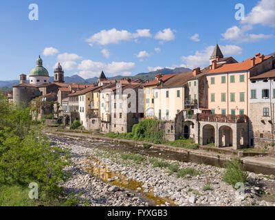 Pontremli, ancient town in north Tuscany, Italy. View along river with church. Stock Photo