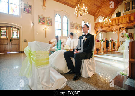 christian wedding couple at catholic church Stock Photo