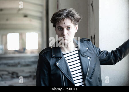 Portrait of a Young Man in Abandon Building. Stock Photo