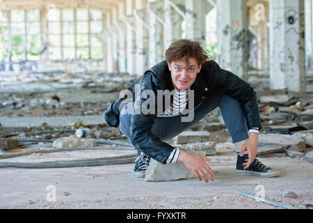 Portrait of a Young Man in Abandon Building. Stock Photo