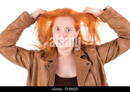 Stressed red hair girl isolated in white Stock Photo