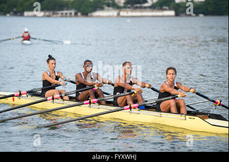 RIO DE JANEIRO - APRIL 2, 2016: A quadruple scull boat (with four rowers) competes in a race on Lagoa Rodrigo de Freitas lagoon. Stock Photo