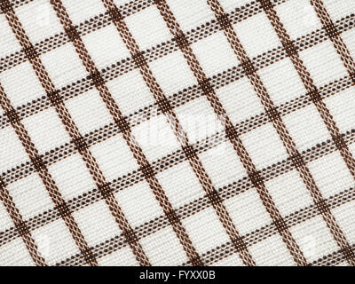 textile background - checkered cotton fabric with Calico weave pattern of threads close up Stock Photo