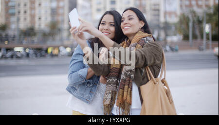 Two gorgeous women posing for a selfie Stock Photo