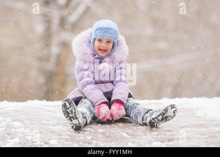 Boy Sliding Down a Hill in the Snow in Winter Stock Image - Image of funny,  motion: 155288621