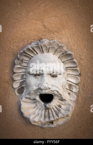 Sculpture of a face with open mouth Stock Photo