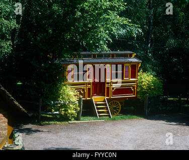 Fortune teller caravan tucked into the trees and bushes, outside. Stock Photo