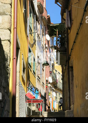 Small historic street or alley with houses in Ribeira district in Porto, Portugal Stock Photo