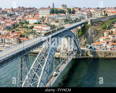 View of Dom Luis I Bridge, city walls and historic district Ribeira from Mosteiro da Serra do Pilar in Gaia, Porto, Portugal Stock Photo