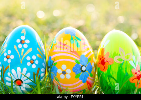 Handmade Easter eggs on grass. Floral Stock Photo