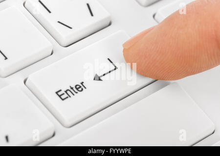 White computer keyboard and hand Stock Photo