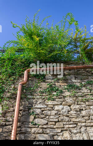 Gutter on wall Stock Photo