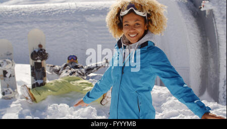 Two skiers with outstretched arms in the snow Stock Photo