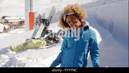 Two skiers with outstretched arms in the snow Stock Photo