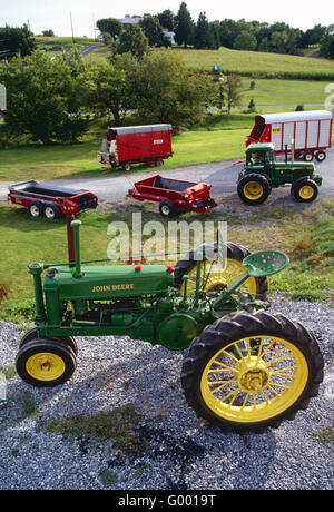 Mint condition antique John Deere tractor & other farm equipment on central Pennsylvania farm Stock Photo