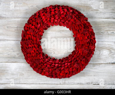 Wooden Red Wreath on White aged boards Stock Photo