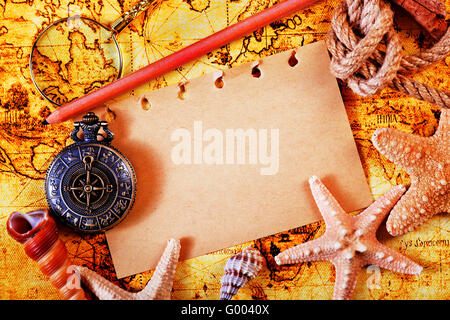 old notebook, loupe and compass on the map Stock Photo