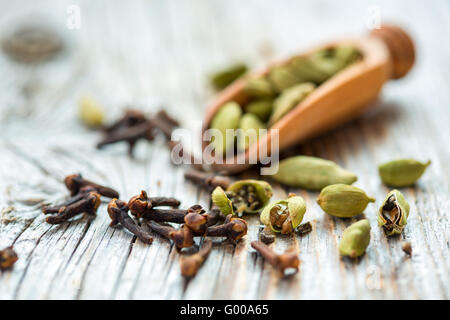 Dry beans cardamom and clove buds. Stock Photo