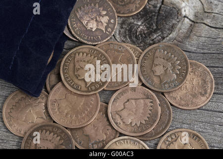 Bag of Vintage Coins on old wood Stock Photo