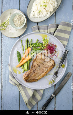 Saithe Fish with Rice and Vegetable Stock Photo