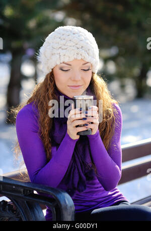 beautiful young girl drinking coffee in a old town cafe - outdoo Stock Photo