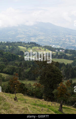 Rolling farmland on the hillside beaneath the Poas Volcano in Costa Rica. Stock Photo