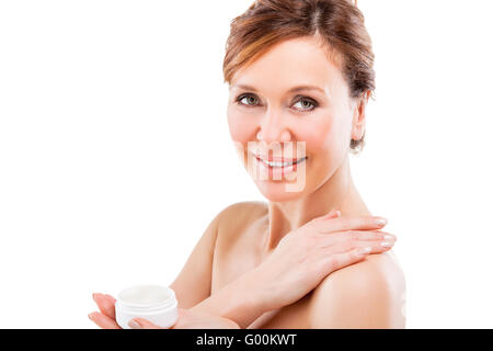 beautiful adult woman applying cream. Stock Photo