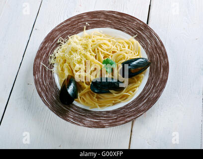 Spaghetti alle vongole -  Italian for spaghetti with clams.including Rome and further south in Campania Stock Photo
