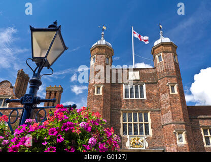 Abbot's Hospital a Jacobean alms house flying the cross of St. George in High Street  Guildford, Surrey, England Stock Photo