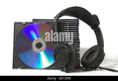 Black headphones on a pile of CD on a white background Stock Photo