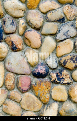 The abstract pattern of wall constructed with pebbles Stock Photo