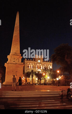 Menorca, Balearic Islands: Es Born Square with the obelisk and the iconic Town Hall in Ciutadella at night Stock Photo