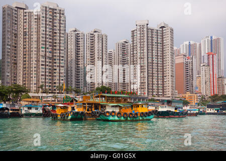Traditional fishing trawlers in the Aberdeen bay, famous floating village in Hong Kong Stock Photo
