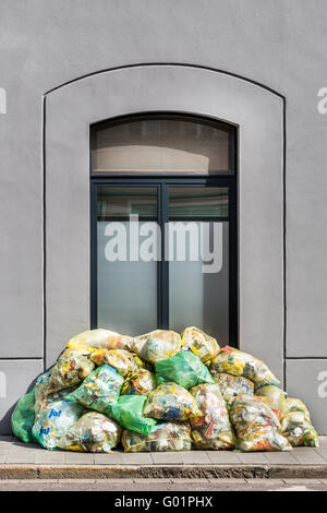collect garbage, separate, recycle, recycling, garbage bags stack picking up outside the house, building, garbage mountain, coll Stock Photo