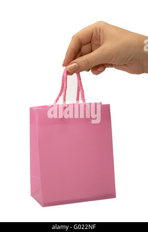 Pink Shopping Bag in female hand isolated on white with clipping path Stock Photo